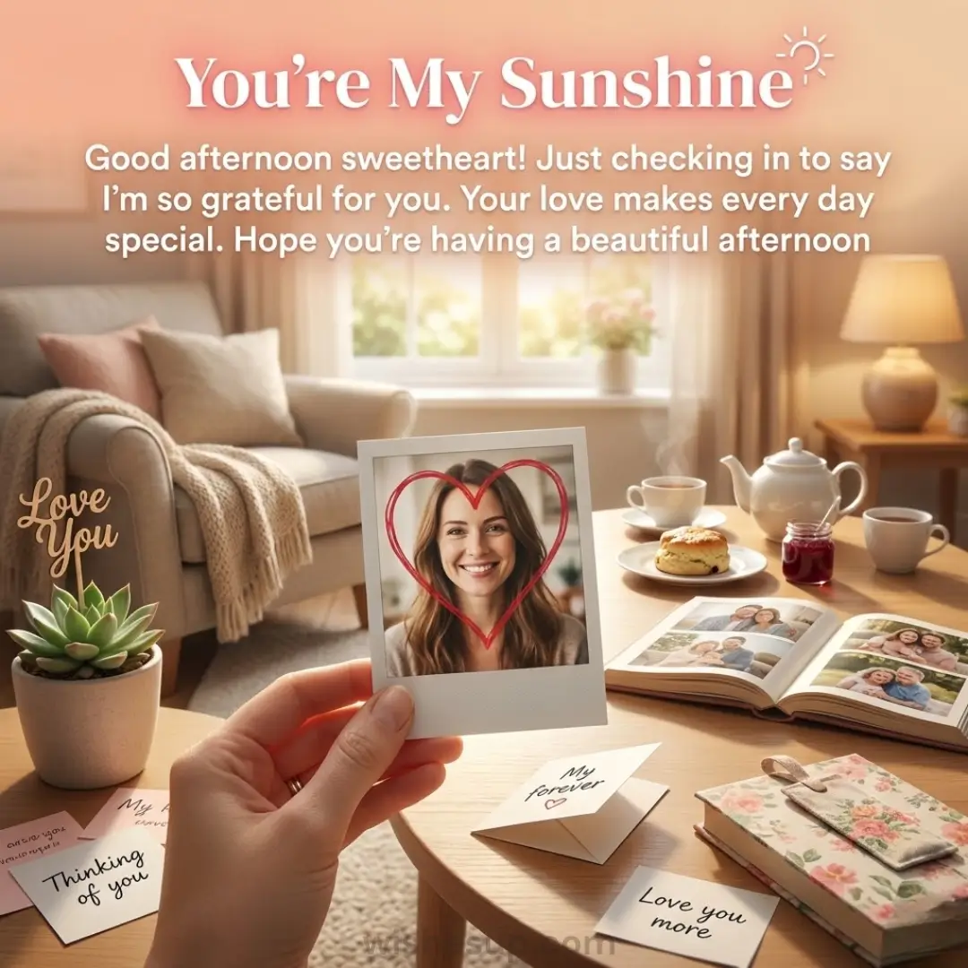 A hand holds a polaroid of a smiling woman circled by a red heart in a sun-drenched room. A soft golden glow bathes a ceramic tea set and handwritten notes on a wooden table, creating a cozy, sentimental atmosphere.